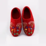 Side view of red Merino wool slippers with suede sole
