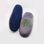 Side view of grey Merino wool slippers with suede sole
