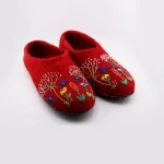 Close-up of red embroidered wool slippers, reinforced toe