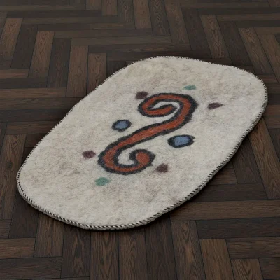 Handmade Turkmen felt rug with orange swirl and multicolor dots on natural wool base