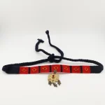 "Detailed view of handcrafted Turkmen silver (varsho) pendant with brass plating and bronze dangles on kilim headband"