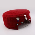 Close-up of hand-mounted mirrors and colored sequins on open-weave fabric