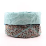 Drawstring Termeh pouch fully open showing pale sky-blue satin lining