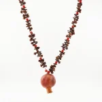 tribal necklace featuring aromatic clove and dried pomegranate