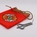 Pocket-sized 10 cm handmade Turkmen Zanburak held in hand – perfect travel instrument
