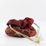 Luxury drawstring Termeh pouch fully open showing glossy burgundy satin lining