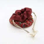Burgundy Persian Termeh jewelry pouch with dense Boteh Jegheh patterns – side view