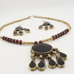 Afghan Turkmen handmade tribal necklace and earrings set on white background