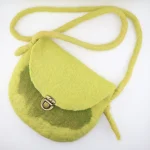 Iranian Turkmen woman's handmade lime green felt crossbody bag worn diagonally across body