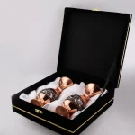 Two engraved copper vases presented in a luxury black velvet gift box