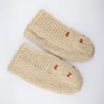 Close-up of authentic Gilaki handmade wool slipper socks in beige with orange zigzag patterns – traditional Iranian hand-knitted design