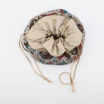 Top view of Termeh jewelry pouch with satin drawstring closure
