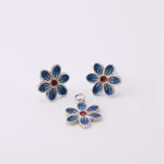 Close-up of handmade Persian Mina Kari cloisonné enamel detailing on silver jewelry