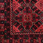 Close-up of fine Kork wool pile and Turkmen Gul motifs in deep red
